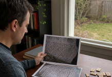 Understanding Runes and The Meanings Researcher comparing illustrative inscription photographs and a rune reference at a home desk